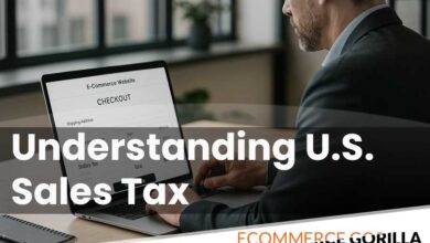 A business owner reviewing sales tax calculations for an online store on a laptop screen in a modern office.